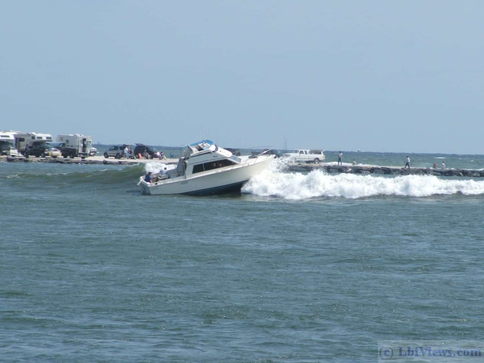 Boat heading out through the breakers in Barnegat Inlet