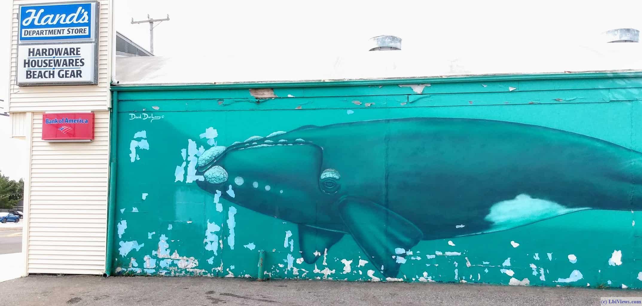 Mural of two right whales on the north side of Hands in North Beach Haven.